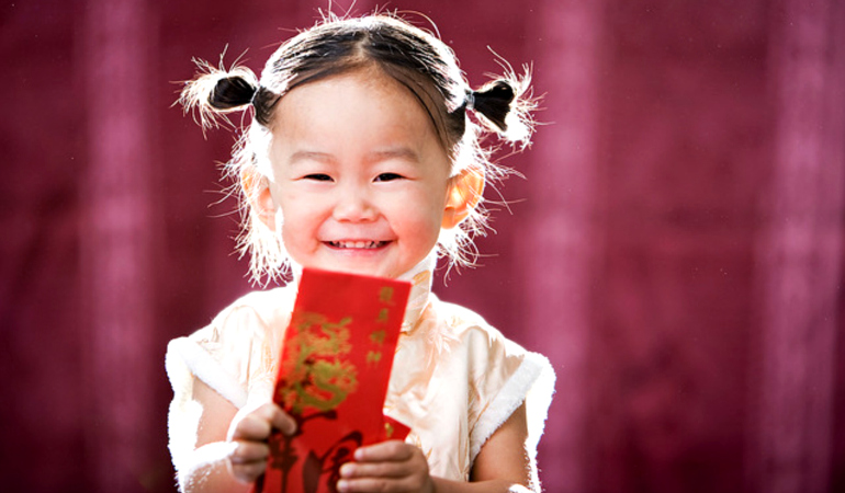 Close-up Of Vietnamese Red Envelopes With Money Being Presented On